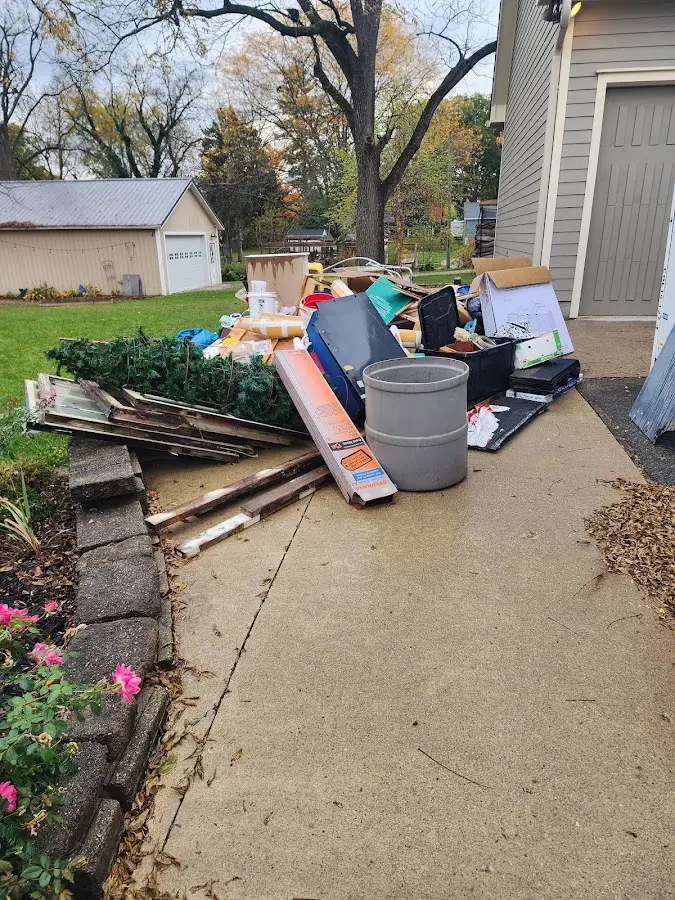 Dumpster being loaded with debris for Residential Dumpster Rental in Fort Stewart